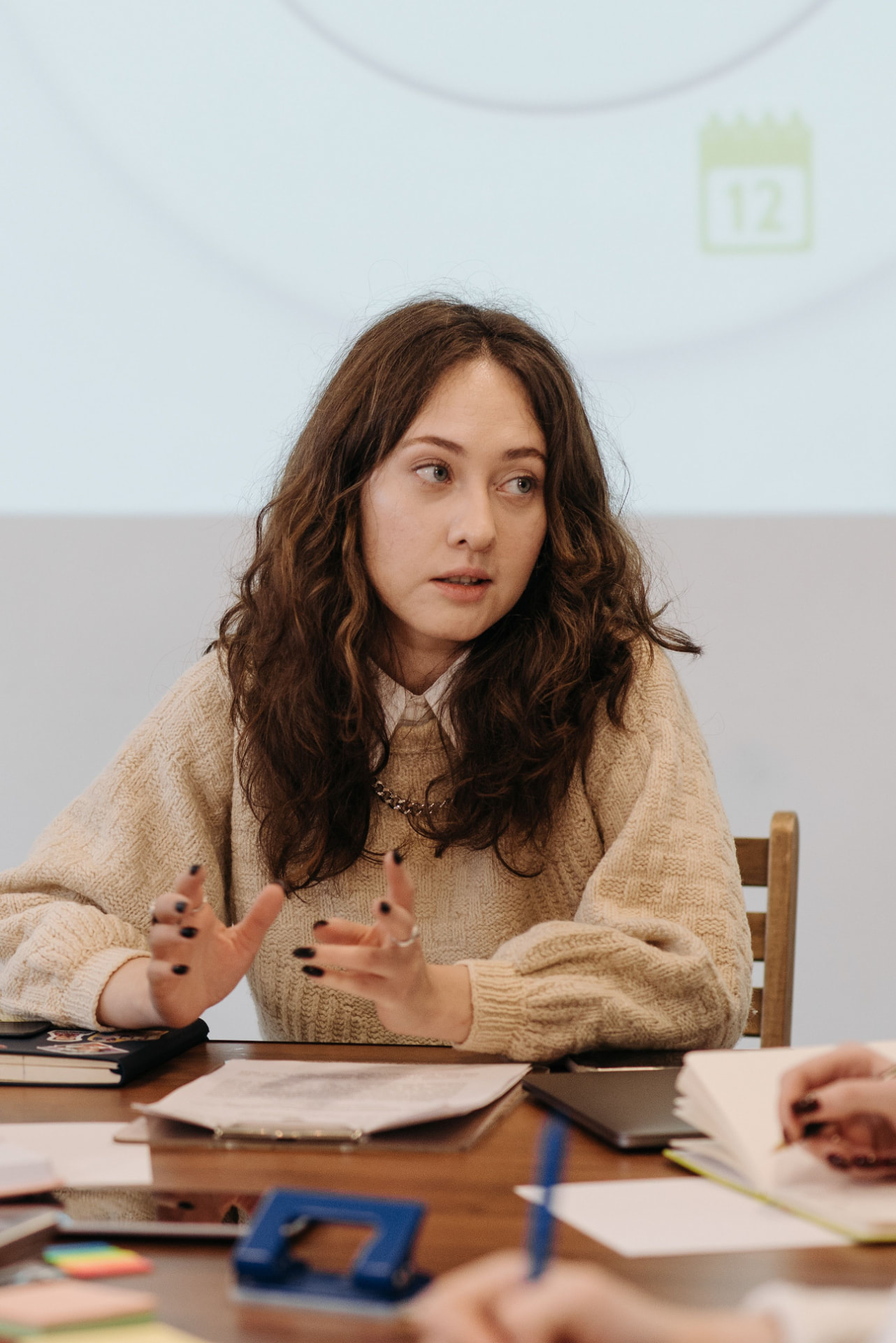 A person discussing ideas at a community meeting
